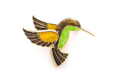 enamel brooch with Hummingbird isolated on whiteの写真素材