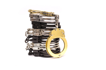 Stack of handcuffs isolatedの写真素材