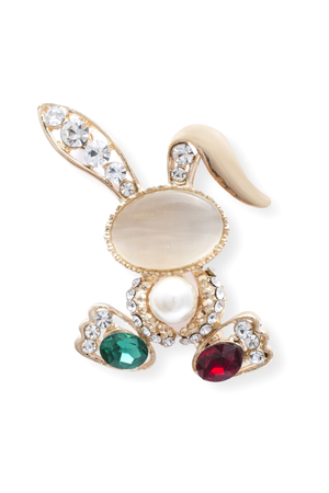 Golden brooch bunny with diamonds and moonstone isolated on whiteの写真素材