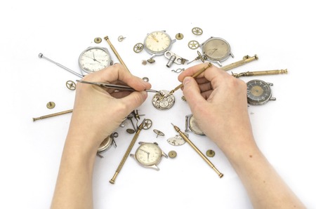 Repair of mechanical watches isolated on whiteの写真素材