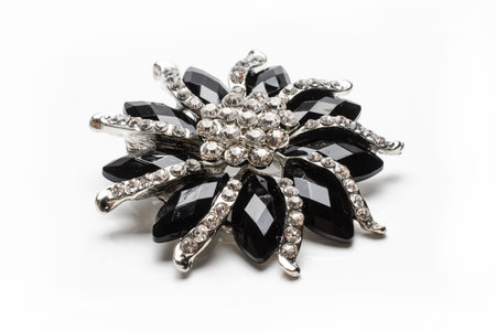 brooch flower with gems stones isolated on whiteの写真素材