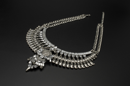 Vintage necklace in Boho style with diamonds isolated on blackの写真素材