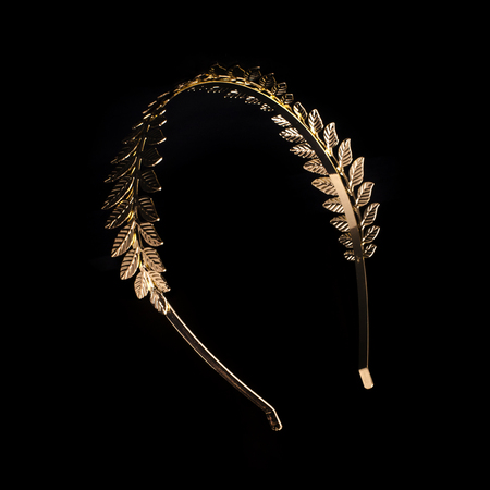 golden laurel wreath headband isolated on blackの写真素材