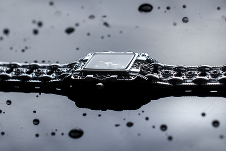 Women's silver wrist watch isolated on blackの写真素材