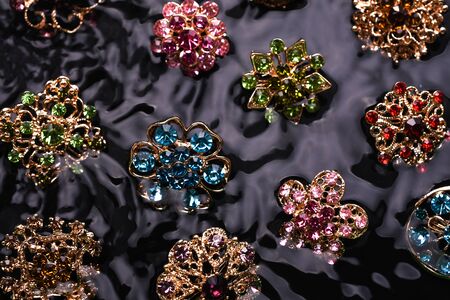 many brooches fish on the water backgroundの写真素材