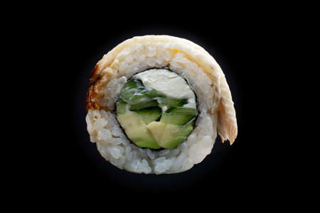 one sushi roll close up on black backgroundの写真素材