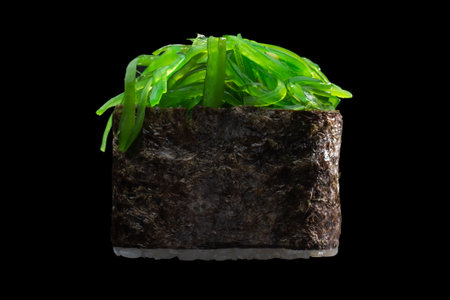 one sushi roll close up on black backgroundの写真素材