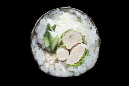 single maki roll isolated on black backgroundの写真素材