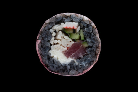 one sushi roll close up on black backgroundの写真素材