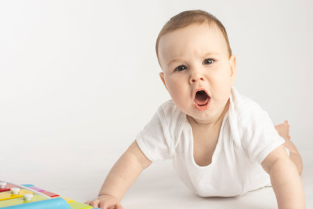 disgruntled baby looking at the camera.