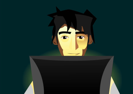 Man sitting infront of monitor at night