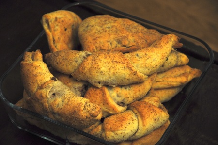 Baked flushed croissants in square glass dish.の写真素材