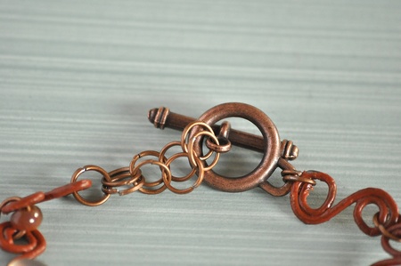 Part of jewellery with copper colour clasp.の写真素材