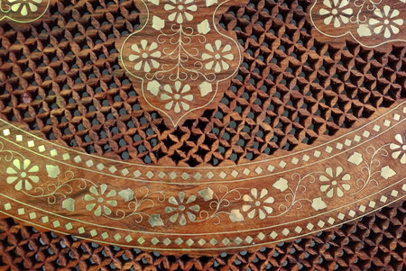 Wooden background with floral ornamental pattern and metall elementsの写真素材