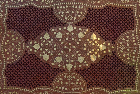 Wooden background with floral ornamental pattern and metall elementsの写真素材