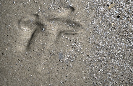 Crosses carved in the sand from water wave made in 3dの写真素材