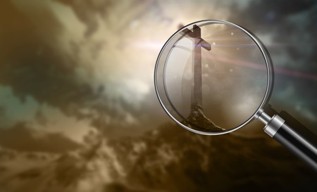 wooden cross on a hill at sunsetの写真素材