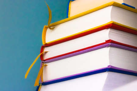 Bookshelf: colorful books in hardcover, various literatureの写真素材