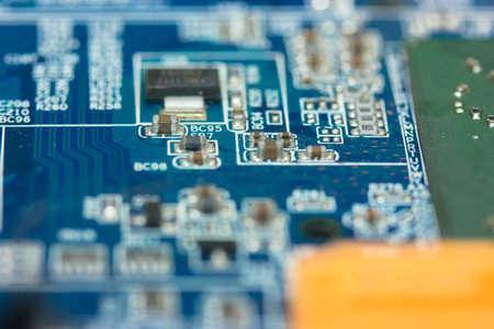 The reverse side of the colorful microboard on a blue background. Electronic board with electrical...