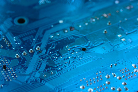 The reverse side of the microboard on a blue background. Electronic board with electrical...