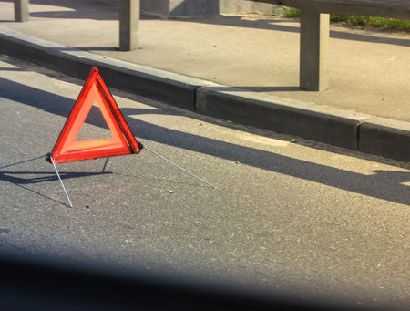 Road traffic accident: emergency stop sign, retroreflective red triangle