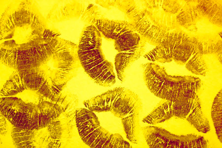 Purple kisses isolated on yellow background flatly. Lots of female lip prints on paper. Beautiful...