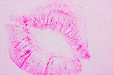 Bright pink female lip print on white background. Kiss, smack, lipstick print, mark. Femininity,...