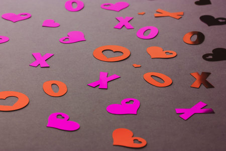 Red pink decorative hearts top view flat lay. Bright shiny confetti tinsel for the holiday....