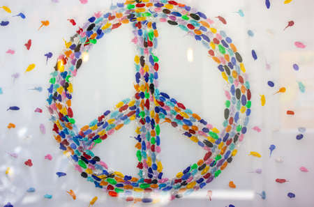 Madrid, Spain. June 1, 2022. Multicolored peace symbol made of colorful elements. Anti-war sign isolated on white background. hippie theme. Stop war, save the world concept. Classical symbol of the 60's.のeditorial素材