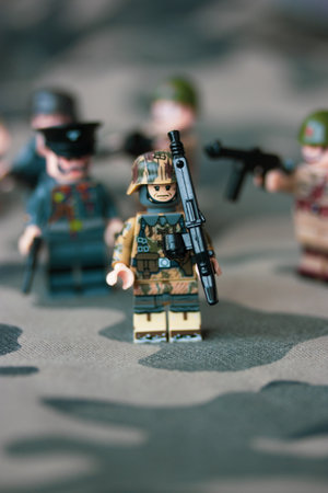 Kyiv, Ukraine. March 9, 2022. LEGO soldiers from Second World War. Toy soldier in camouflage uniform with machine gun, weapon. Troops, regiment. War in Ukraine. Formations of armed forces, military.のeditorial素材