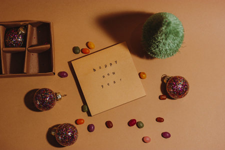 Stylish vintage retro layout mockup greeting card, text Happy New Year 2023 top view. Brown greeting...