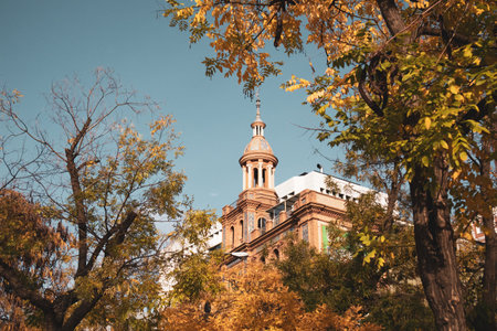 Madrid, Spain. November 20, 2023 ABC Serrano Commercial Center. Vintage architecture in a fall season among yellow trees. Beautifully decorated ornate facade of a brick old building, palace exterior.のeditorial素材