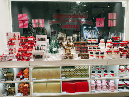 Madrid, Spain. November 21, 2023 Showcase with various home and decor products for New Years theme. sales in a shopping mall. interior of a shop with goods for kids. Presents for Christmas tree.のeditorial素材