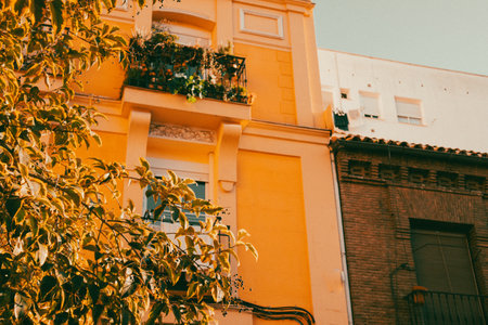 Madrid, Spain. 1 June 2023 European architecture. Details of ornate historic facade. Apartment orange house on an old city street. Travel brochure, lifestyle magazine.のeditorial素材