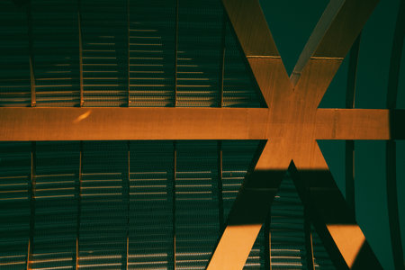 Metal mesh lattice construction in warm sunlight Urban architecture in sunshine. Modern architectural details Shadow sun lightの写真素材