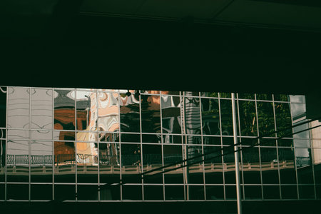 The abstract architecture features reflections in a glass building, creating a unique perspective of...