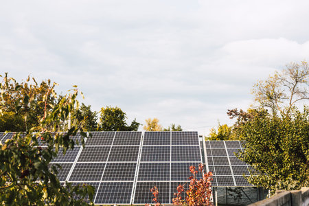 Solar panels installed on a rooftop, generating clean energy. A view of solar panels on a rooftop,...