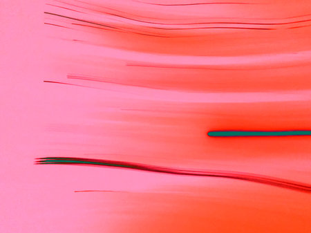 Vibrant abstract background with flowing red and orange gradient tones and dynamic linear streaks. Energetic lines, movement. Digital design, UI backgrounds, social media graphics, visual identity.の写真素材