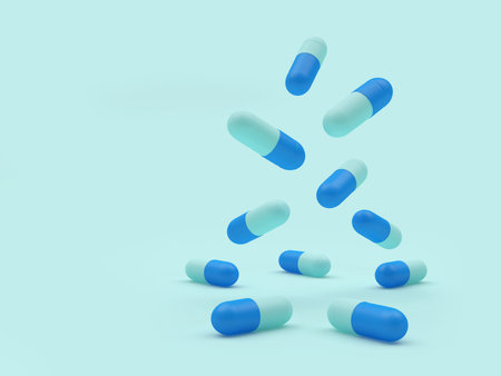 Blue medical capsules fall on turquoise. 3d illustrationの写真素材