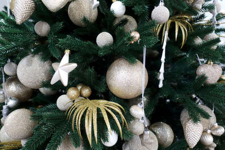 Christmas tree decorated with balls and stars and toysの写真素材