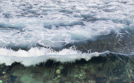 Sea foam on the waves.の写真素材