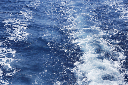 Sea foam on the waves.の写真素材