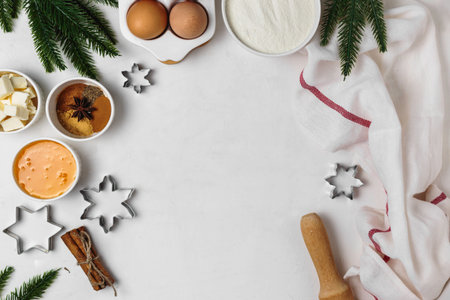 Ingredients for making gingerbread for the new year. Layout of products, cookie cutters with Christmas decor around.Holiday baking concept. Top viewの写真素材