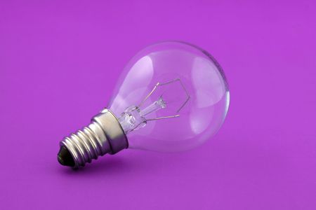 Small electrical lamp over pink backgroundの写真素材