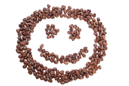 smile in coffee beans, isolated on white backgroundの写真素材
