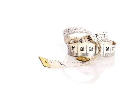 White measuring tape on white backgroundの写真素材