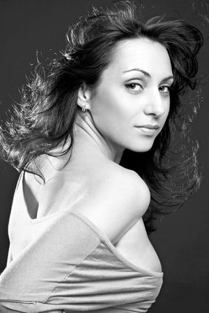 Smiling beautiful woman, on dark backgroundの写真素材