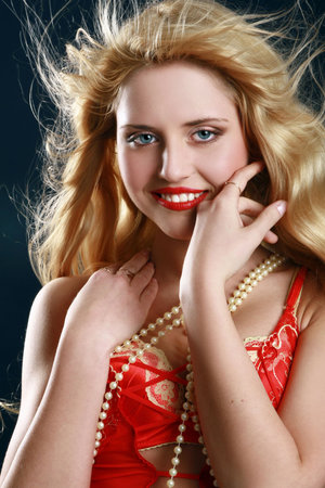 Beautiful woman in red dressの写真素材