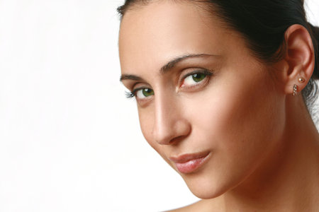 Close-up portrait of young, nice girl with green eyes, isolated