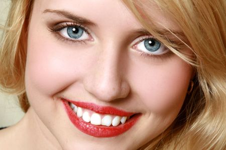 Close-up portrait of cheerful young womanの写真素材